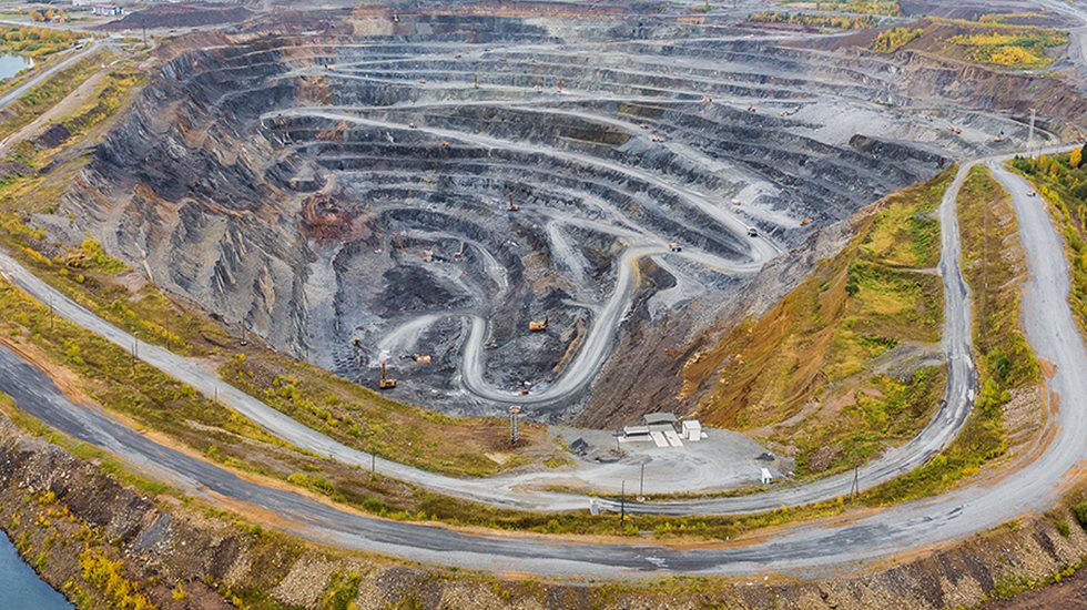 Aerial image of an open pit mine.