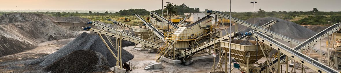 Equipment for manufacturing sand pictured in sunrise.