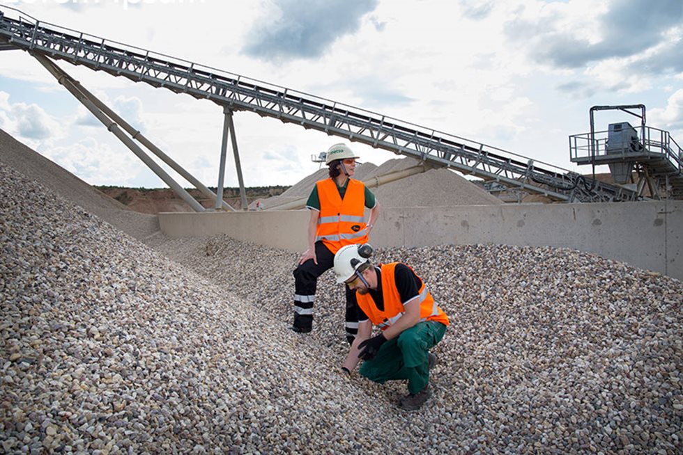 Two employees checking the aggregates final product at Conveyors at the Bogaevsky Bogaevsky Karyer JSC